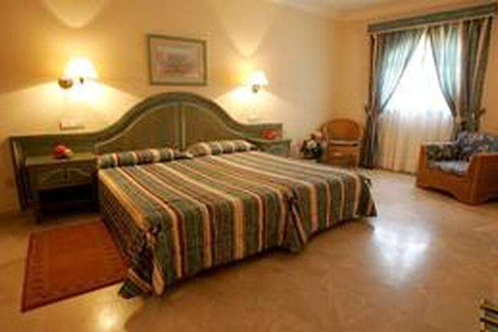 de slaapkamer van '5-persoonskamer, Familiesuite'