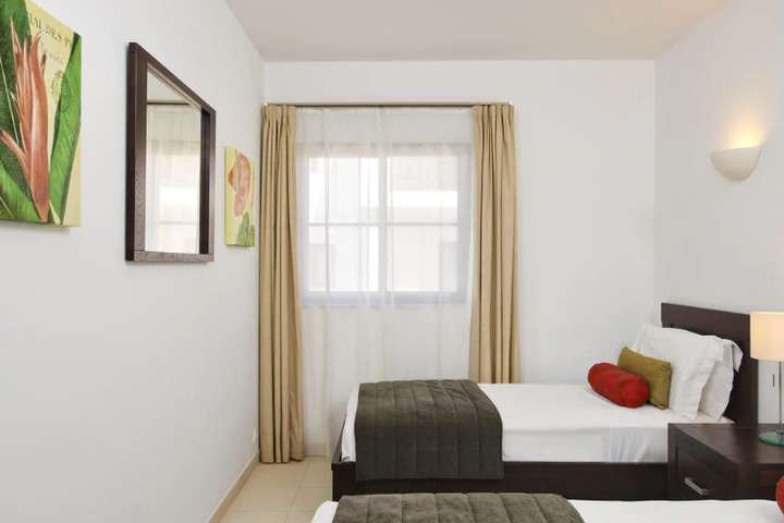 Slaapkamer met twin bed van 'Suite met twee slaapkamers'