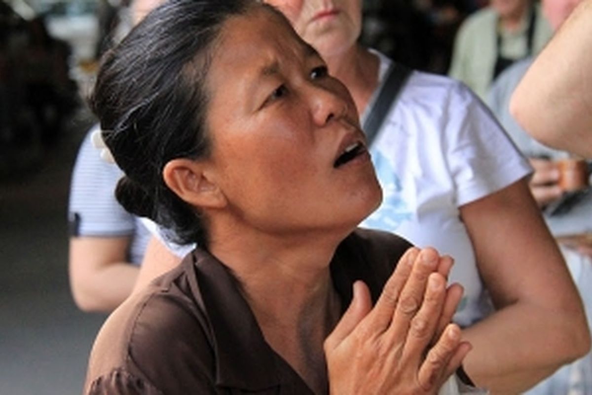 biddende/bedelende Thaise vrouw, Thailand